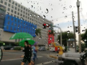 Blurred motion of man on wet window