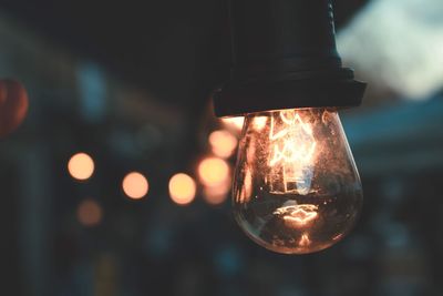 Close-up of illuminated light bulb