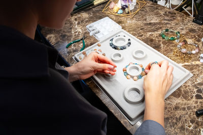 Cropped image of man working on table