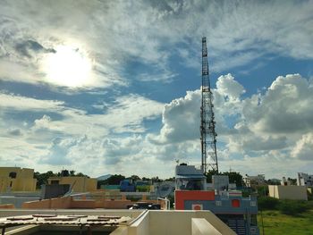 Buildings against cloudy sky