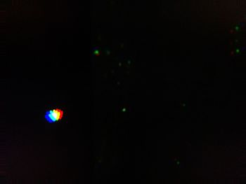 Close-up of illuminated lights in the dark