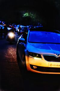 Close-up of car on street at night