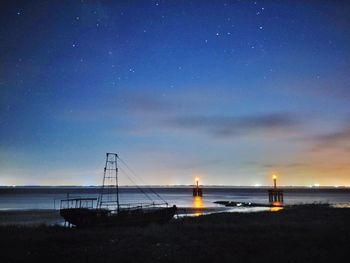 Scenic view of sea against sky at night