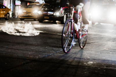 Low section of bicycle on street at night