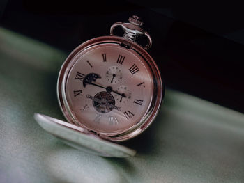 Close-up of clock on table