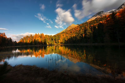 Lej nair in the engadine valley in the swiss alps in an autumn landscape