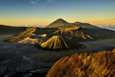 Scenic view of snowcapped mountain against sky during sunset