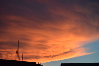 Low angle view of dramatic sky during sunset