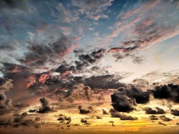 Scenic view of landscape against dramatic sky