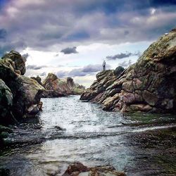 Scenic view of sea against cloudy sky