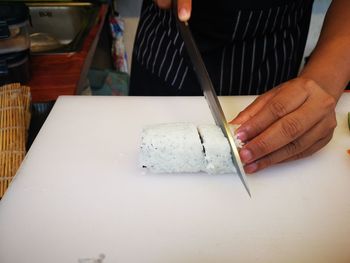 Midsection of person preparing food on table