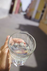 Close-up of hand holding drink