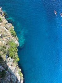 High angle view of rocks by sea