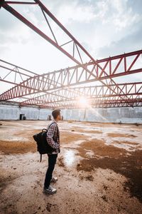 Full length of man with backpack standing outdoors