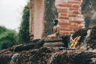 Statue against wall