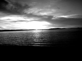 Scenic view of sea against sky at dusk