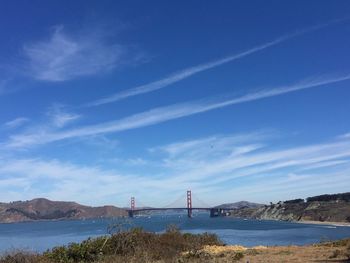 Bridge over bay against sky