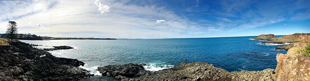 Panoramic view of bay against sky