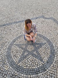 High angle portrait of woman on street