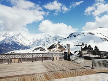 Scenic view of snowcapped mountains against sky