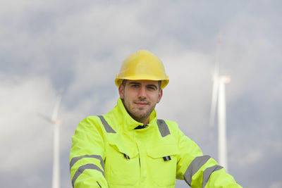Portrait of man working with yellow umbrella