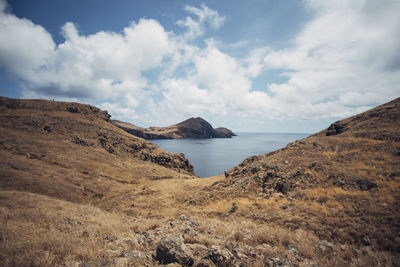 Scenic view of sea against cloudy sky