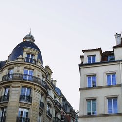 Low angle view of buildings against clear sky