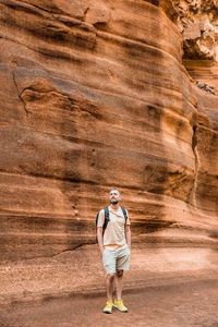 Full length of woman standing on rock