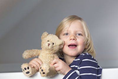 Portrait of girl with teddy