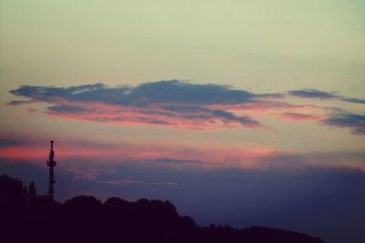 Low angle view of silhouette trees against sky at sunset