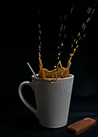 Close-up of drink against black background