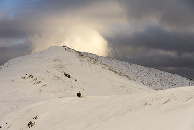 Scenic view of snowcapped mountain against sky