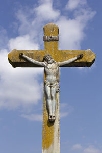 Low angle view of statue against sky