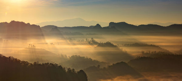 In the morning, a small village on a valley in the north of thailand.