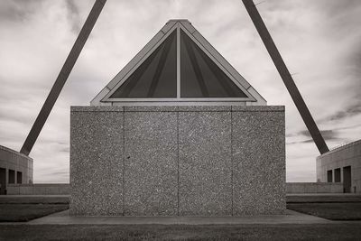 Low angle view of building against cloudy sky