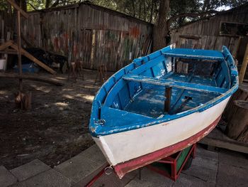 Abandoned boat moored at beach