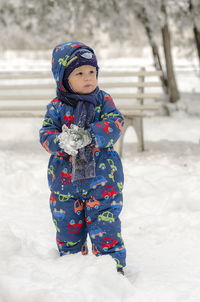 Girl in snow on field during winter