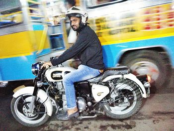 Man riding motorcycle on road