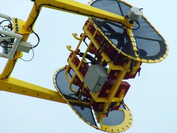 Low angle view of carousel against clear sky