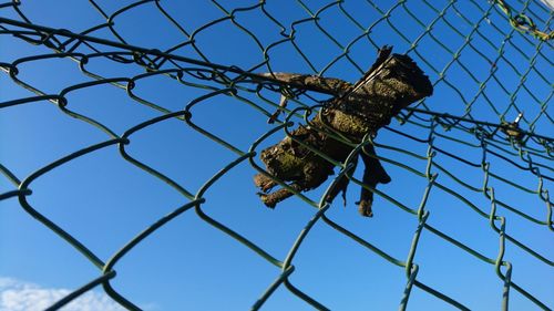 Low angle view of chainlink fence