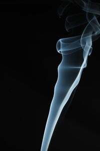 Close-up of smoke against black background