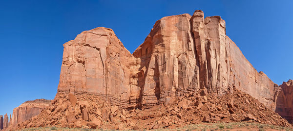 Low angle view of rock formations against sky