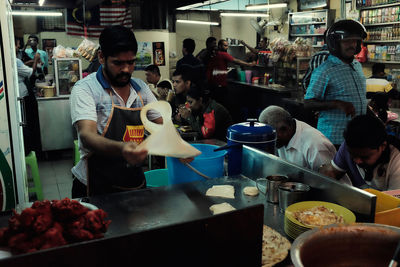 People at market stall