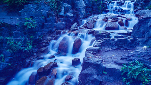 View of waterfall in forest