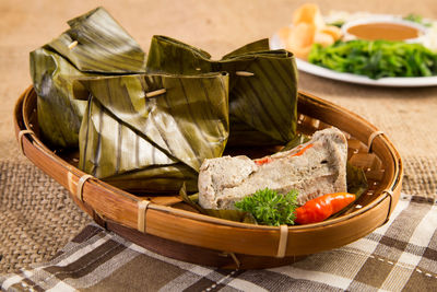 Close-up of vegetables in basket on table