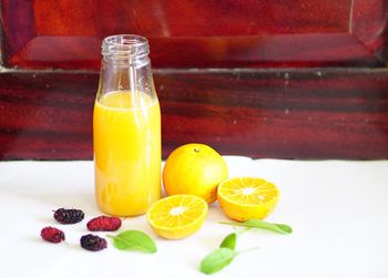 Fruits in glass on table