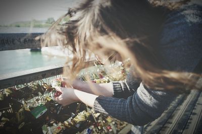 Close-up of woman holding camera