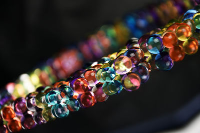 Close-up of multi colored bracelet in darkroom