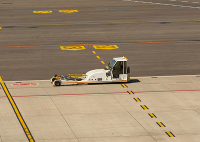 High angle view of airplane on airport runway