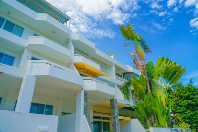 Low angle view of yellow building against sky